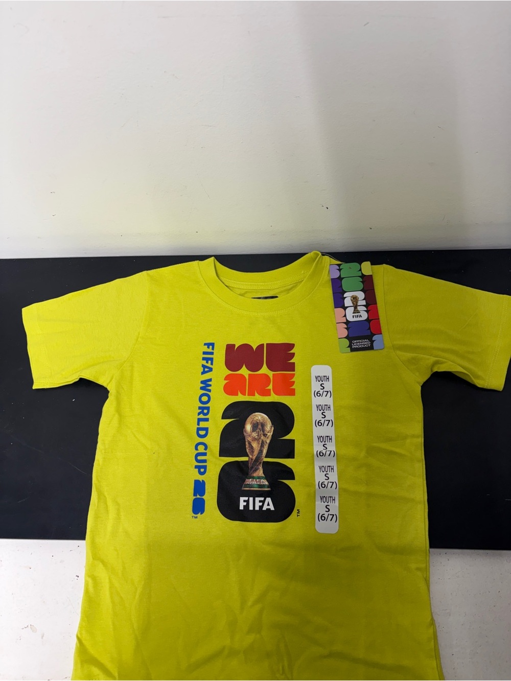 Official FIFA World Cup 2026
Yellow T-Shirt “We ARE FIFA” Youth Size S (NEW)